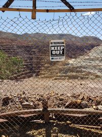 Information sign on chainlink fence