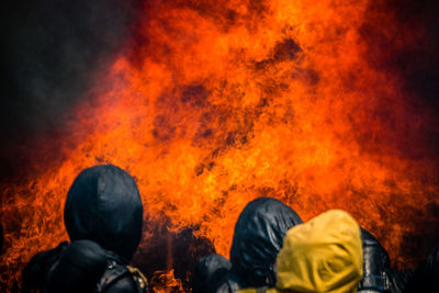 Firefighter against orange fire