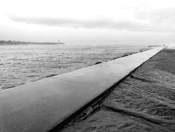 Pier over sea against sky