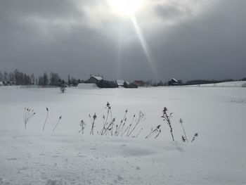 Scenic view of frozen lake against sky during winter