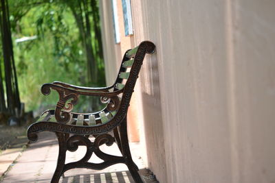 Close-up of metal gate against wall