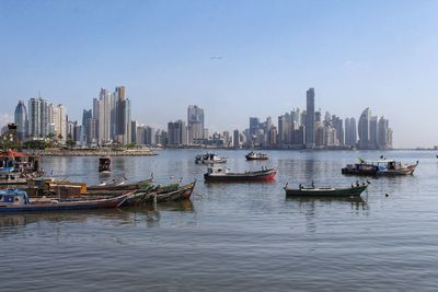 Boats moored at harbor