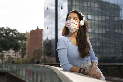 Portrait of beautiful woman in city