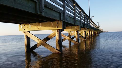 Slow angle view of pier in sea