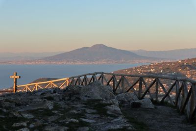Scenic view of bridge over mountains against clear sky