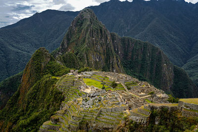 High angle view of sun shining over mountain