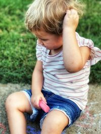 Little girl figuring out what to draw. 