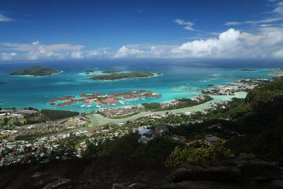 Panoramic view of sea and city against sky