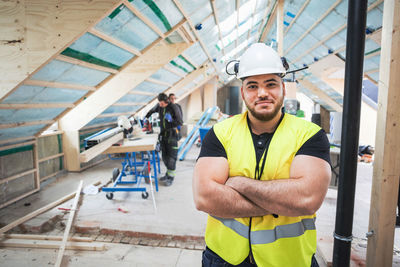 Portrait of young man at construction site