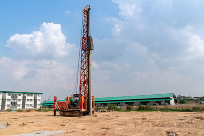 Low angle view of construction site against sky