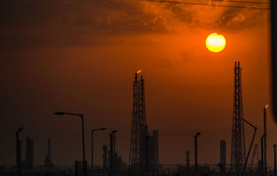 Sunrise over an oil refinery port south of kuwait city