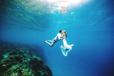 Woman swimming in sea