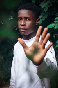 Portrait of young man standing outdoors