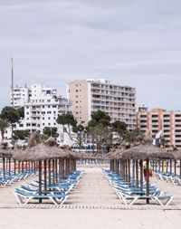 Buildings by sea against sky in city