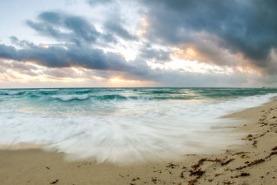 Scenic view of sea against sky during sunset