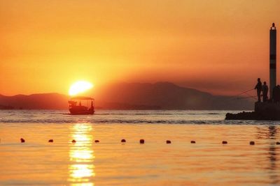 Scenic view of sea at sunset