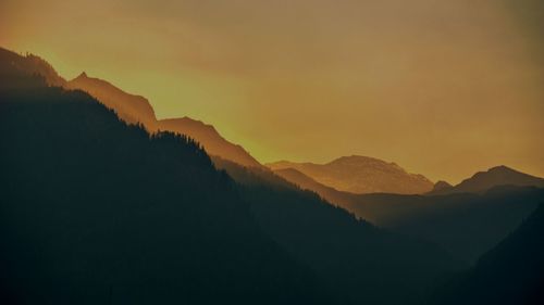 Scenic view of mountains against sky during sunset