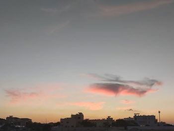 Smoke emitting from chimney against sky at sunset