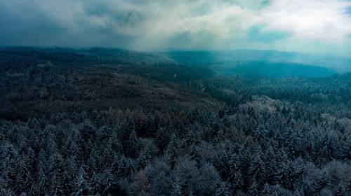 Scenic view of landscape against sky during winter