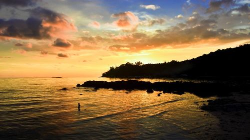 Scenic view of sea against sky at sunset