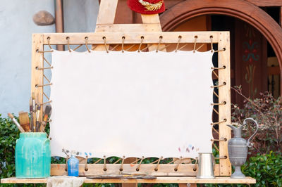 White canvas prepare for painting watercolor with wooden frame, many type of bushes for painting