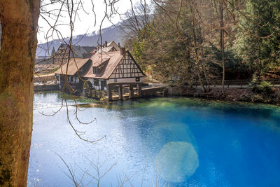 View of lake against houses