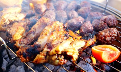 High angle view of meat on barbecue grill