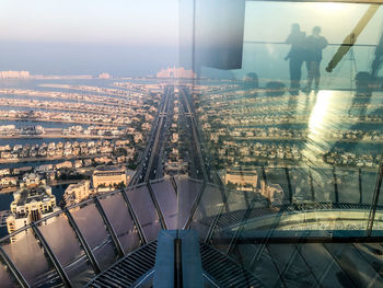 High angle view of illuminated city buildings against sky