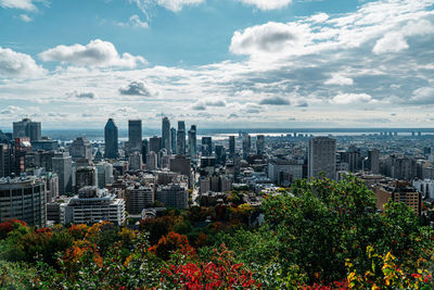 Aerial view of city buildings against sky