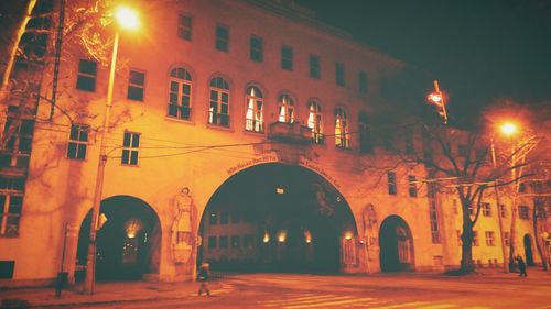 Low angle view of illuminated building at night