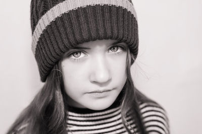 Close-up portrait of girl wearing knit hat