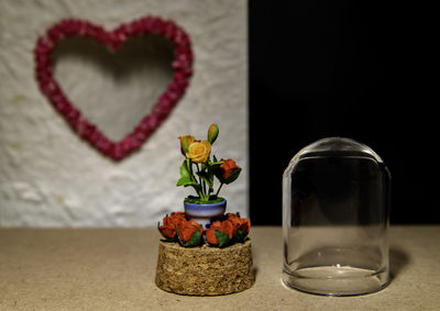 Close-up of heart shape on glass table