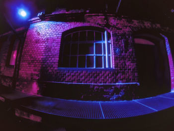 Low angle view of illuminated light against building