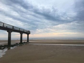 Scenic view of beach against sky during sunset