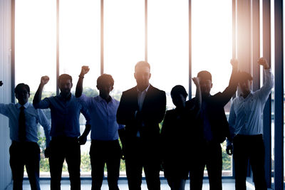 Group of people standing against the wall