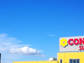 Low angle view of building against blue sky