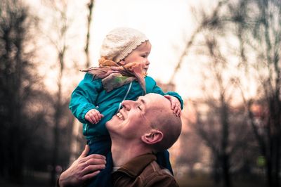 Father and son playing in park