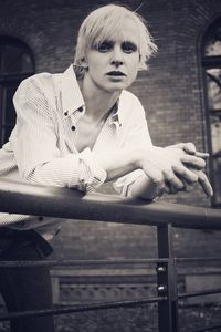 Portrait of woman sitting on bench