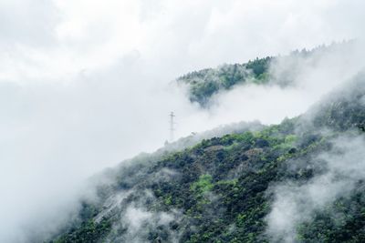 Scenic view of fog against sky