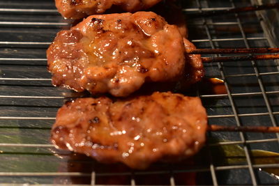 High angle view of meat on barbecue grill