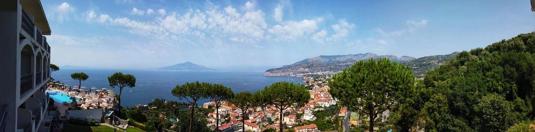 Panoramic view of bay against sky