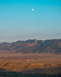 Scenic view of desert against sky during sunset