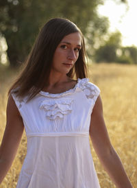 Beautiful woman standing on field