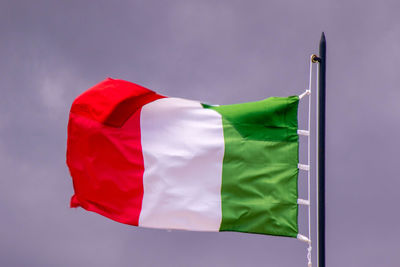 Low angle view of flag against sky