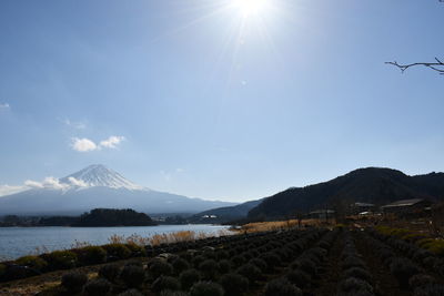 Scenic view of mountains against sky on sunny day