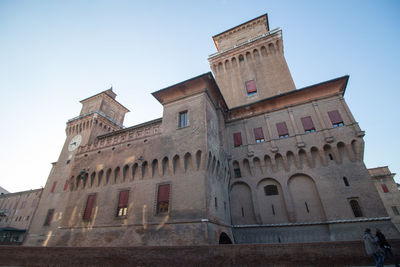 Low angle view of castello estense against sky