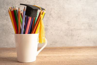 Close-up of multi colored pencils on table