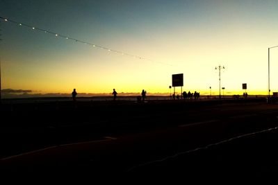 Road against clear sky during sunset