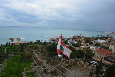 Scenic view of sea and buildings against sky