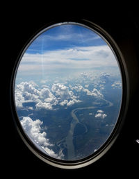 Scenic view of landscape seen through window